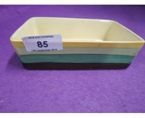 A Newport Pottery pin dish in the Bizarre pattern by Clarice Cliff