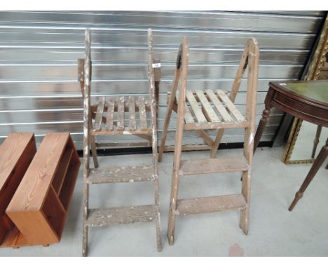 Two vintage wooden step ladders