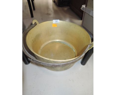 A vintage brass cast jam pan