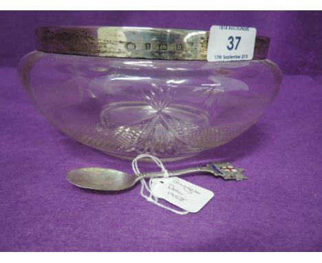 A cut glass trifle bowl having silver rim, Birmingham 1912, makers mark worn, and an HM silver London 1950's souvenir spoon