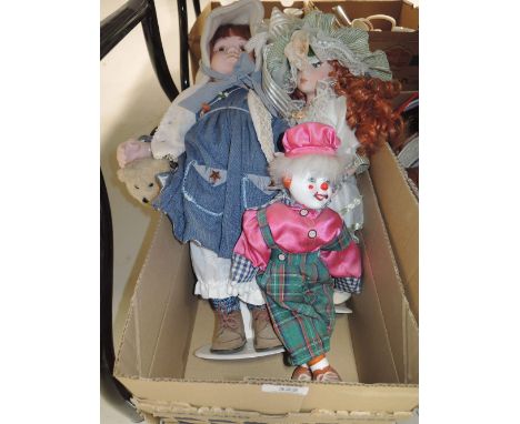 A selection of vintage dolls and clown 