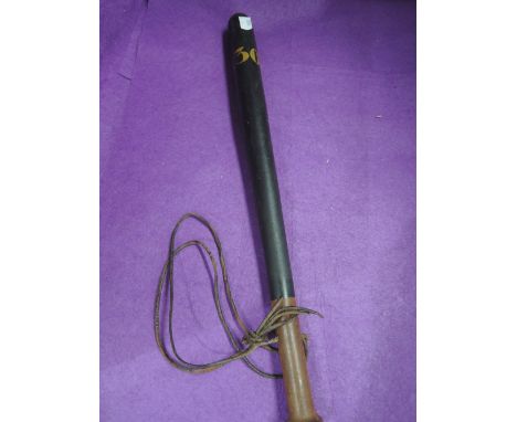 A vintage truncheon bearing the number 130