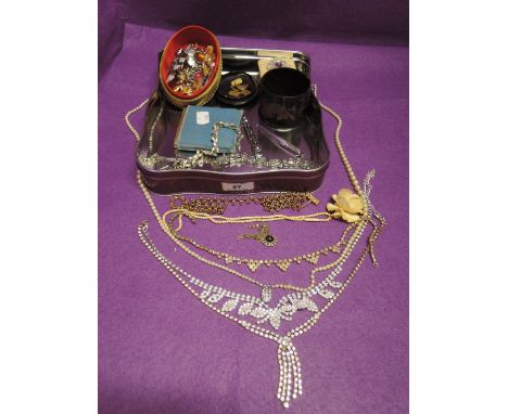 A selection of costume jewellery including diamante, brooches, papier mache trinket, compact etc