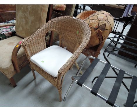 Two wicker tub chairs and a vintage pouffe