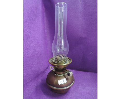 A copper and brass oil lamp
