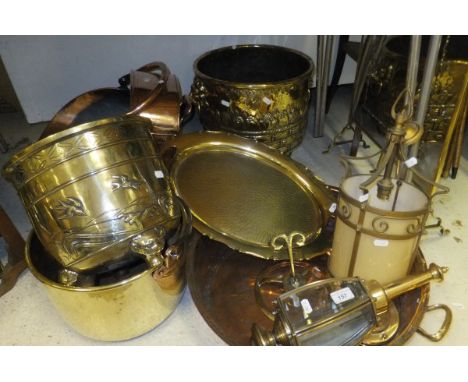 A collection of brass and copper wares to include a Victorian copper coal helmet, a brass log bin with embossed basket decora