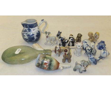 Three small boxes containing a collection of ornaments and other wares to include a small porcelain sparrow beak jug painted 