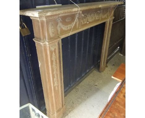 A pine fire surround with applied decoration in the Adams manner CONDITION REPORTS 135cm high, 161cm wide.  Internal dimensio