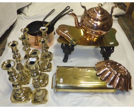 A quantity of various Victorian copper and brass ware to include brass topped iron trivet, French brass foot warmer, copper k