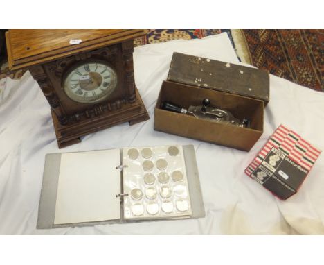A box containing a collection of British coins, a collection of plated cutlery, binoculars, a Dr Macaura's Blood Circulator, 