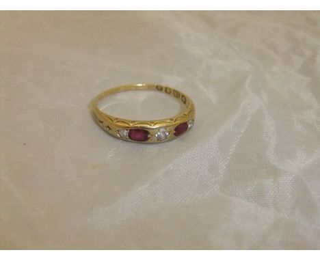 A ruby and diamond set 18 carat gold dress ring CONDITION REPORTS Approx. 2.8 gms including stones, size approx. S/T.  Overal