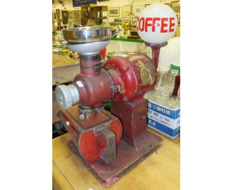 A vintage American coffee grinder "The Lion", inscribed "Justice and Strength Trademark Made in USA" CONDITION REPORTS Total 