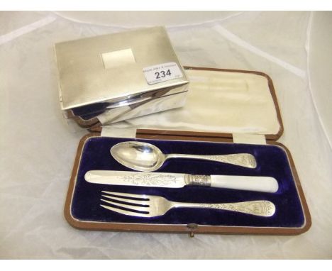 A George V silver Christening set comprising spoon, fork and knife with engraved decoration (Sheffield, 1910), together with 