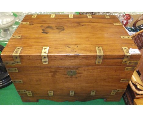 An Indian brass bound teak trunk, the top opening to reveal a lift-out tray and basic fitted interior