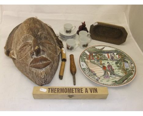 A collection of items to include a carved African mask from Zaire, together with a modern Chinese plate, wooden butter mould,