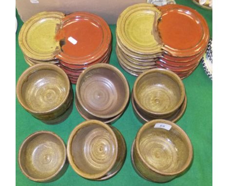A collection of studio pottery plates and bowls