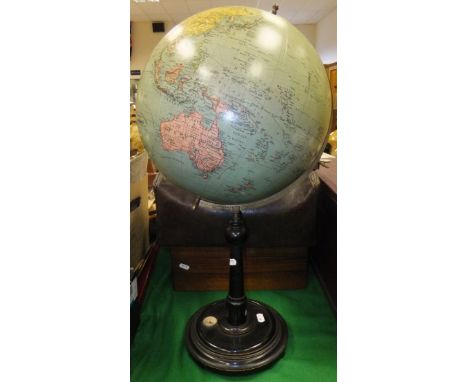 A Jordglob (Stockholm) terrestrial globe, raised on an ebonised base, containing a compass, together with a leather Gladstone