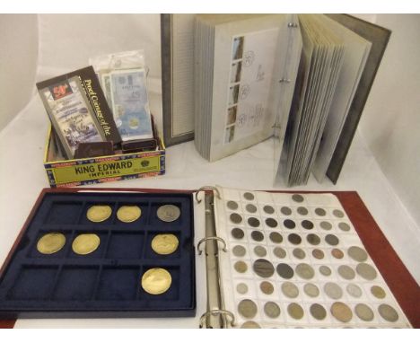 A box containing an assortment of coinage to include commemorative crowns and assorted coins of the realm, together with vari