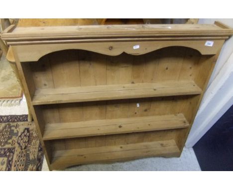 A pine wall hanging three shelf display rack and two spindle back chairs


