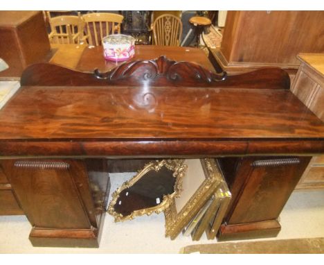 A late Regency/William IV mahogany pedestal sideboard, the raised foliate decorated back over three cushion drawers on two ar