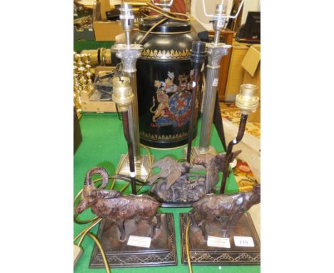 A collection of five various table lamps including two decorated with bronze figures of goats, another decorated with bronze 