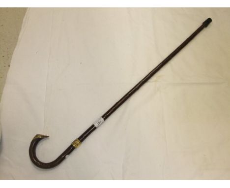 An 18 carat gold mounted walking stick