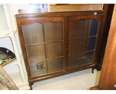 A modern six shelf open bookcase together with an oak wall hanging cabinet, a 20th Century mahogany three shelf display cabin