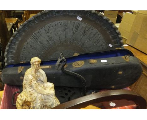 A box containing a large Eastern metal circular tray, a black painted wrought metal footman, a marble effect circular platter