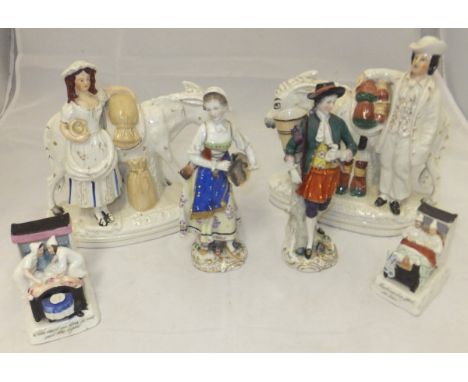 A pair of early 20th Century Dresden figures, a pair of Staffordshire figure groups, a lady and a gentleman with a donkey, on