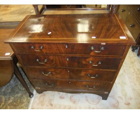 A 19th Century mahogany chest of four long drawers on bracket feet