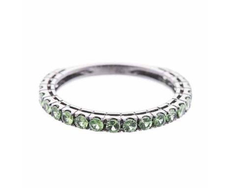 A DEMANTOID GARNET THREE-QUARTER ETERNITY RING claw-set with circular mixed-cut demantoid garnets weighing approximately 0.78