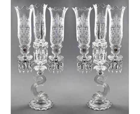 A PAIR OF BACCARAT COLOURLESS FROSTED GLASS FOUR-LIGHT CANDELABRA each with a dolphin support issuing into a drip pan adorned