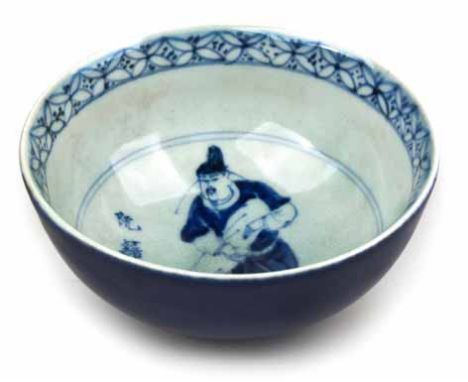 A CHINESE BLUE AND WHITE BOWL, QING DYNASTY, 19TH CENTURY rising from a short raised foot into a sight flared rim, the interi