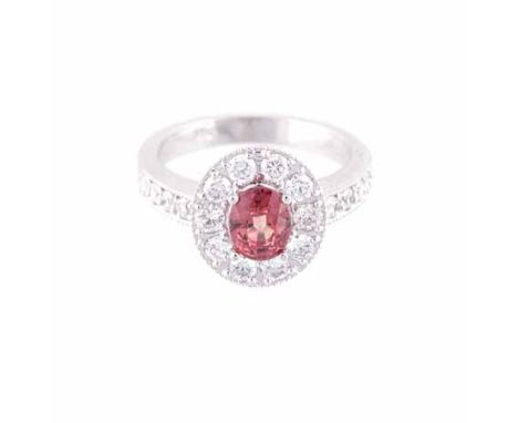 A SAPPHIRE AND DIAMOND RING centred with an oval mixed-cut sapphire, weighing approximately 1.36cts, the conforming surround 