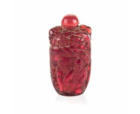 A CHINESE PEKING GLASS SNUFF BOTTLE of deep red tone, one side carved with 'Shou Lao' tending a deer, the other with a boy an