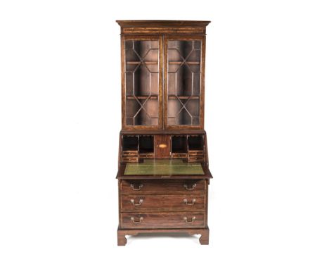 A GEORGE III STYLE MAHOGANY BUREAU BOOKCASE in two parts, the outswept cornice above an inlaid frieze, a pair of astragal gla