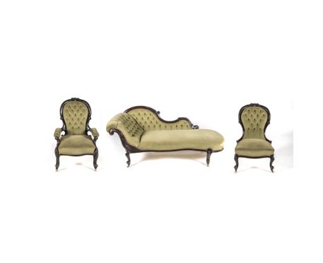 A VICTORIAN MAHOGANY SALON SUITE comprising: a grandfather chair, a grandmother chair and a chaise longue, each padded button