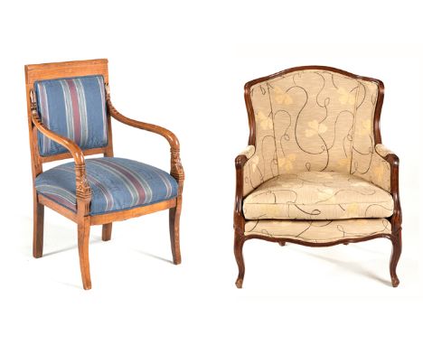 AN UPHOLSTERED ARMCHAIR the padded back and sides within a conforming moulded frame, loose seat cushion, padded apron, on car
