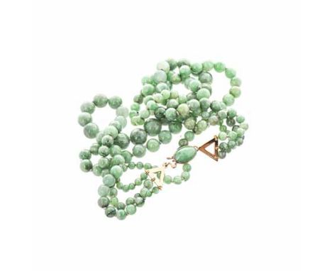 A THREE STRAND JADE-LIKE NECKLACE composed of circular jade-like beads, the clasp embellished with an oval jade-like cabochon