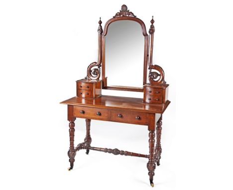 A VICTORIAN MAHOGANY DRESSING TABLE the loose shaped oval plate within a conforming moulded surround, surmounted by a pierced