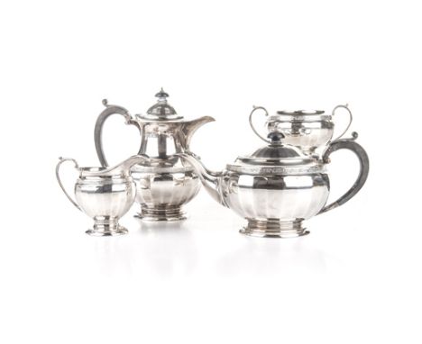 A GEORGE V FOUR-PIECE SILVER TEA SET, POSSIBLY DOCKER & BURN LTD, BIRMINGHAM, 1927 comprising: a teapot, a hot water jug, a m