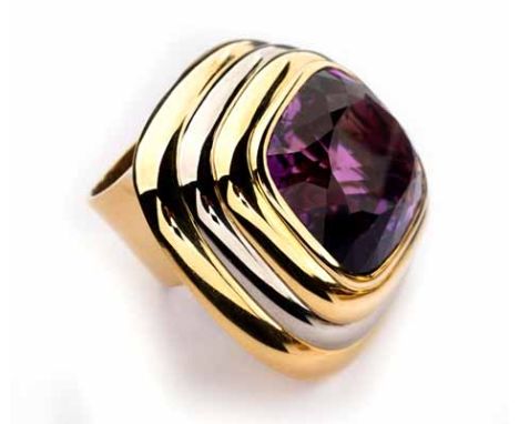 AN AMETHYST DRESS RING, KÖHLER of Art Deco design, centred with a bezel-set cushion-cut amethyst weighing approximately 47.13