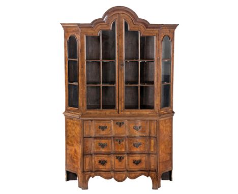 A DUTCH WALNUT AND INLAID DISPLAY CABINET, 19TH CENTURY in two parts, the moulded gabled pediment above a pair of cottage-pan