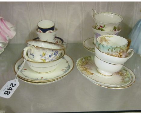 A Royal Crown Derby cup and saucer and other cups and saucers