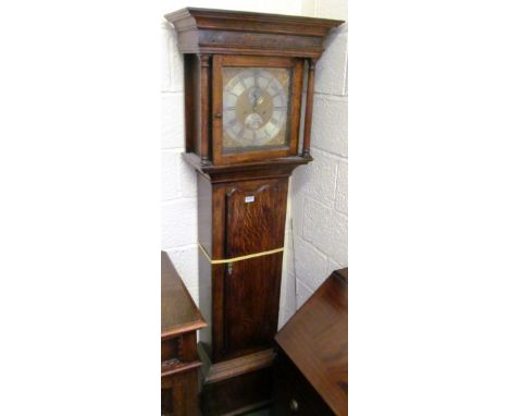 A late 18th/early 19th Century oak longcase clock the hood with blind fret decoration, silver dial with gilt spandrels inscri