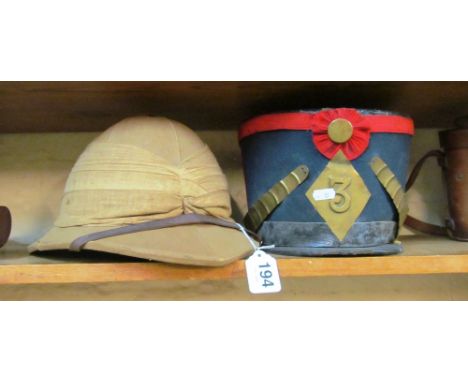 A pith helmet and a French military hat