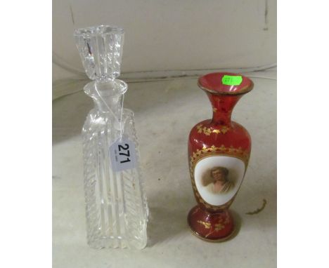 A Bohemian red glass vase portrait of a young woman with gilt embellishments and a glass decanter (a/f)