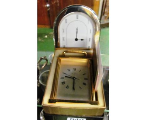 A St James quartz clock and another