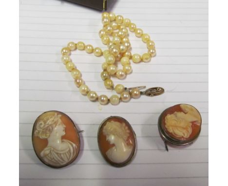 Three cameos and a pearl necklace with 9ct gold clasp