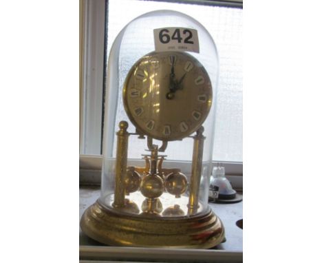 A three hundred and sixty-five day clock under glass dome